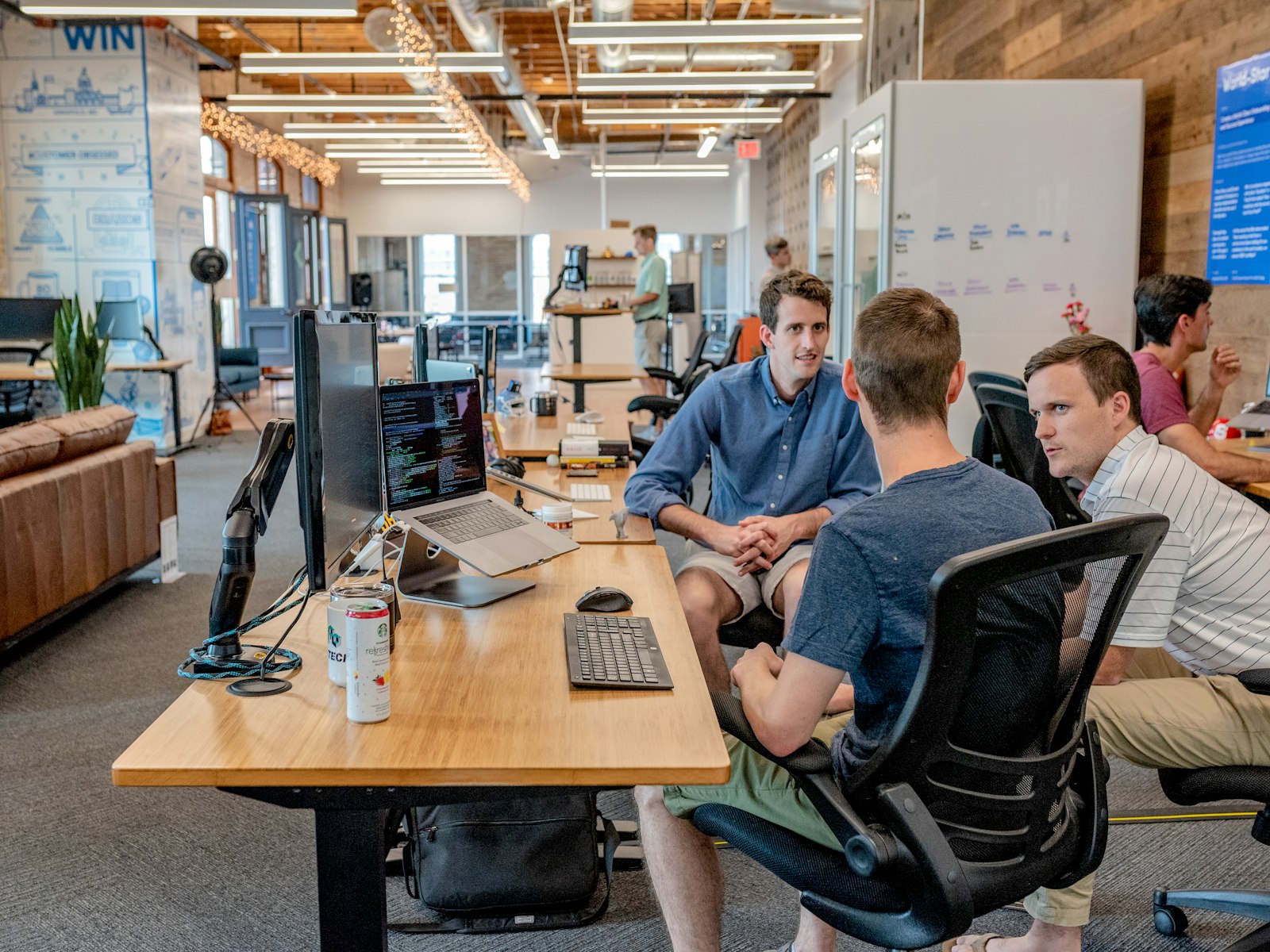 Founders discussing their business around a working desk